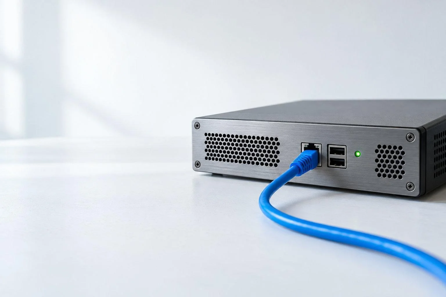 A blue cable plugged into a computerAI-generated content may be incorrect.